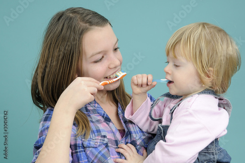 white children washing teeth