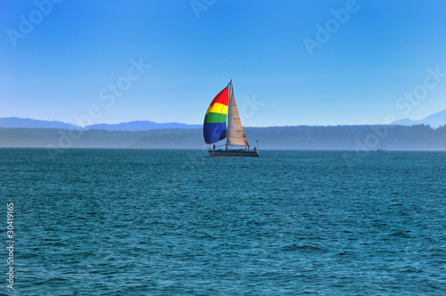 A yacht with a bright sail.