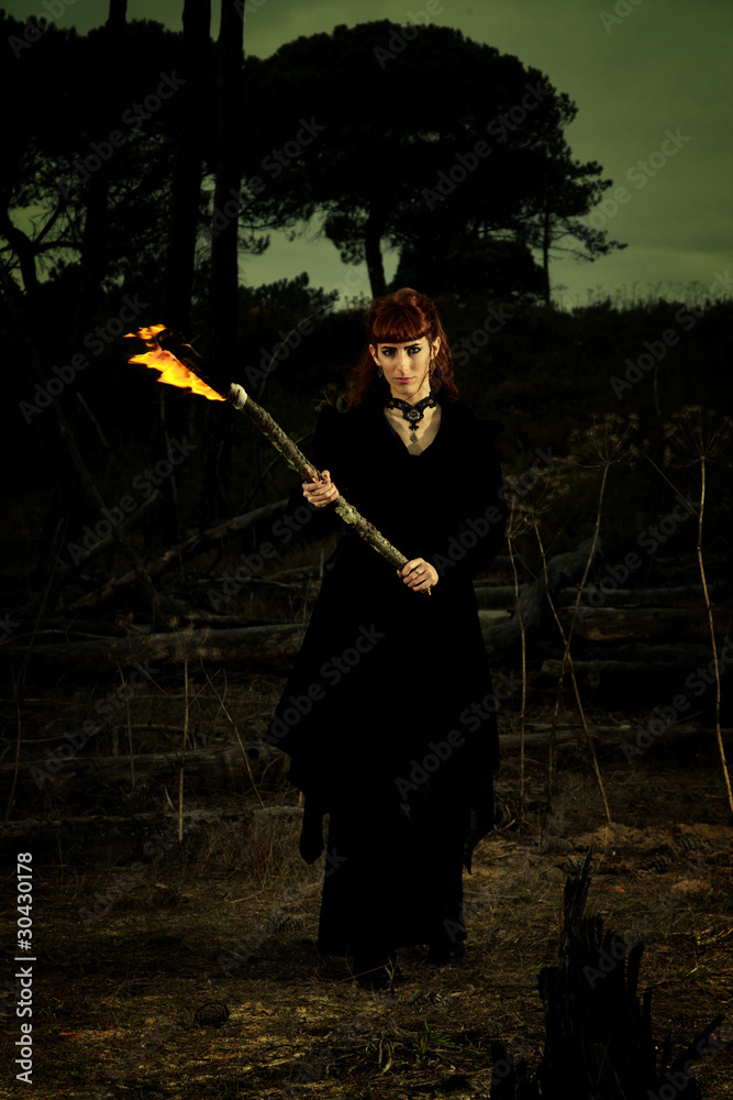 dark woman with torch