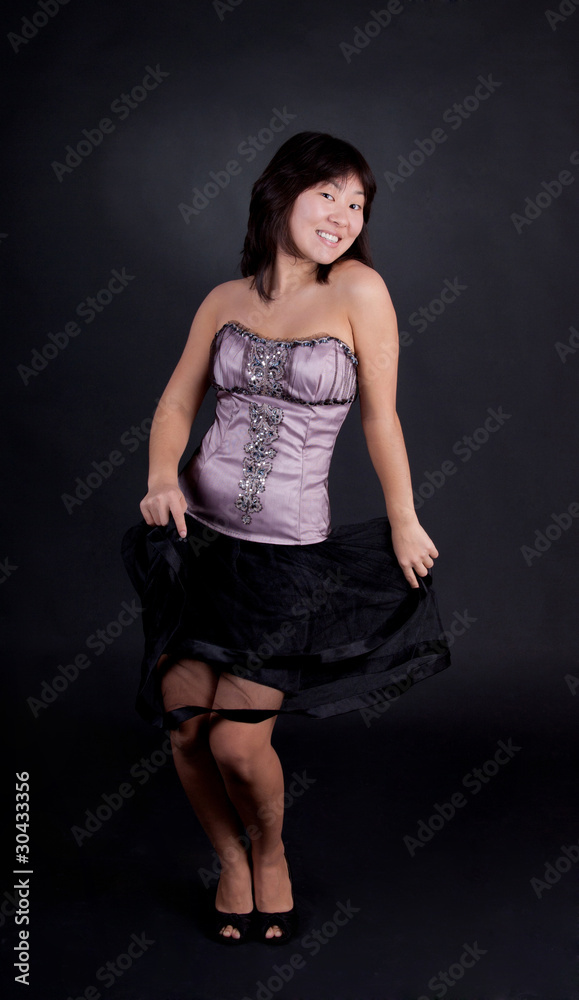 Attractive young Asian woman posing in fashion dress Attractive young Asian woman posing in fashion dress