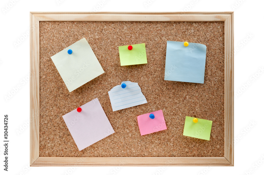 different sticky notes on a cork board isolated different sticky notes on a cork board isolated