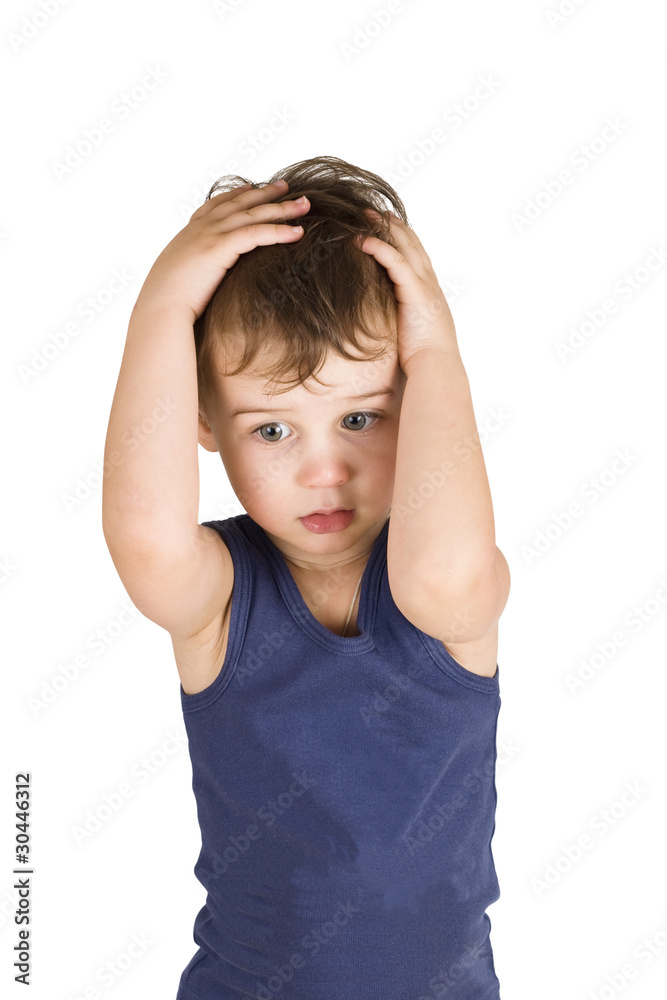 A boy is holding hands on the head isolated on white A boy is holding hands on the head isolated on white