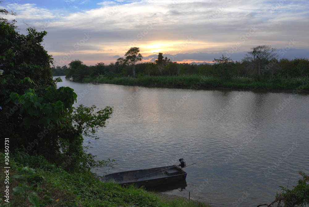 Fototapeta premium Motorboat and Sunset