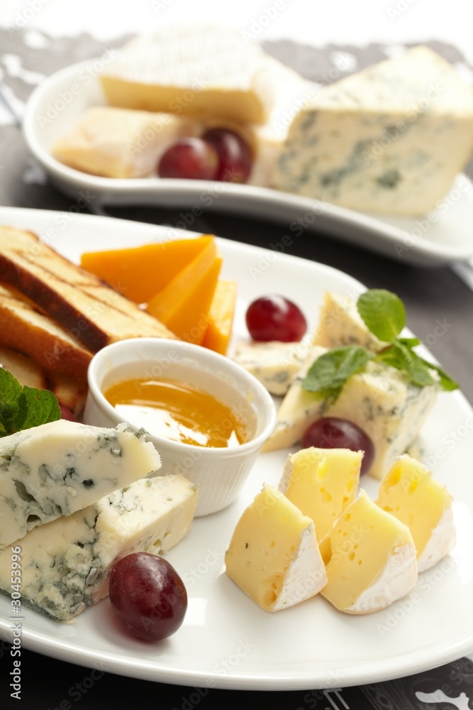 Cheese plate with grapes and honey Cheese plate with grapes and honey