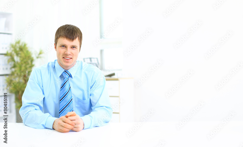 Young businessman in his office Young businessman in his office