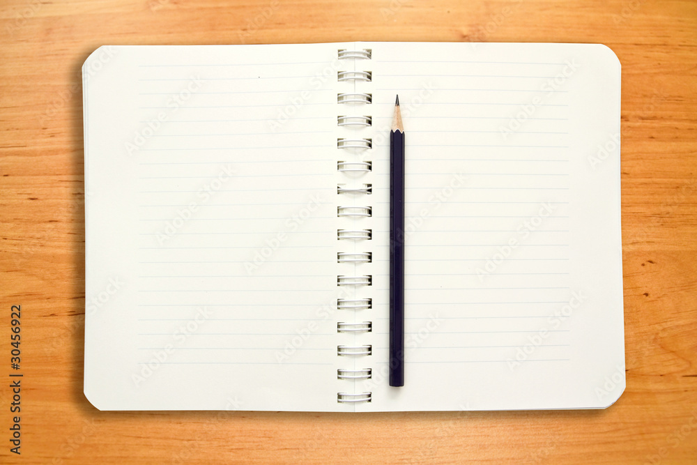blank notebook with pancil on wooden table blank notebook with pancil on wooden table