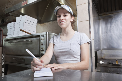 Φωτογραφία Take out order waitress in a fast food restaurant