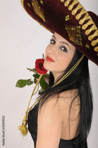 young woman wearing a traditional mexican sombrero