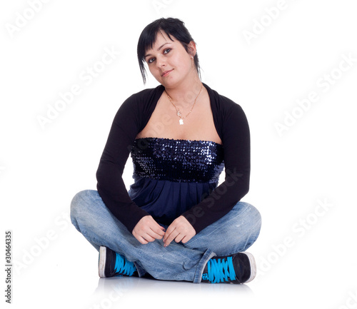 Girl in jeans sitting in the lotus position © Maxim Timokhin