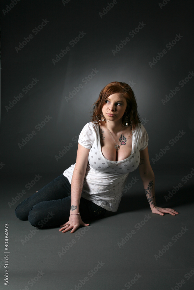 large breasted woman with tattoos Stock Photo