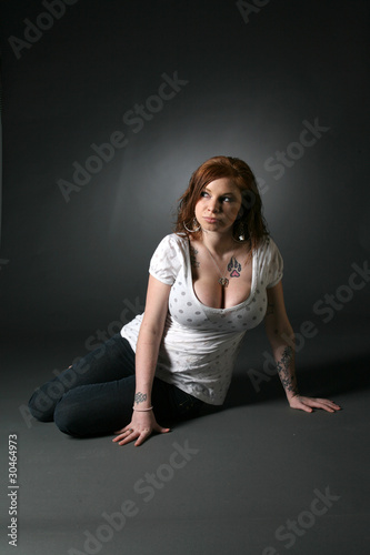 large breasted woman with tattoos
