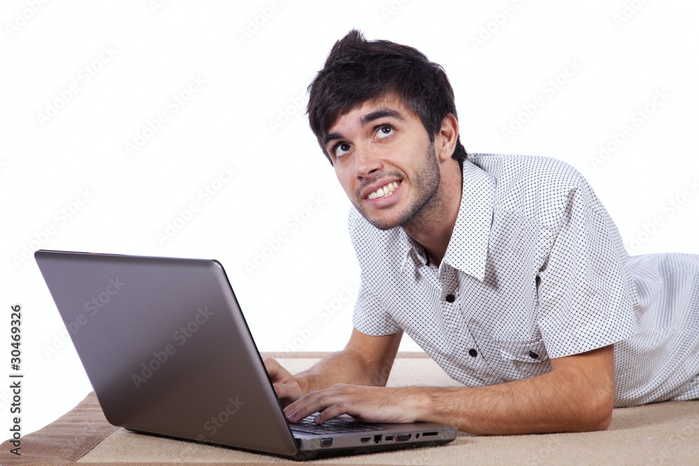 Happy young man surfing the internet Happy young man surfing the internet