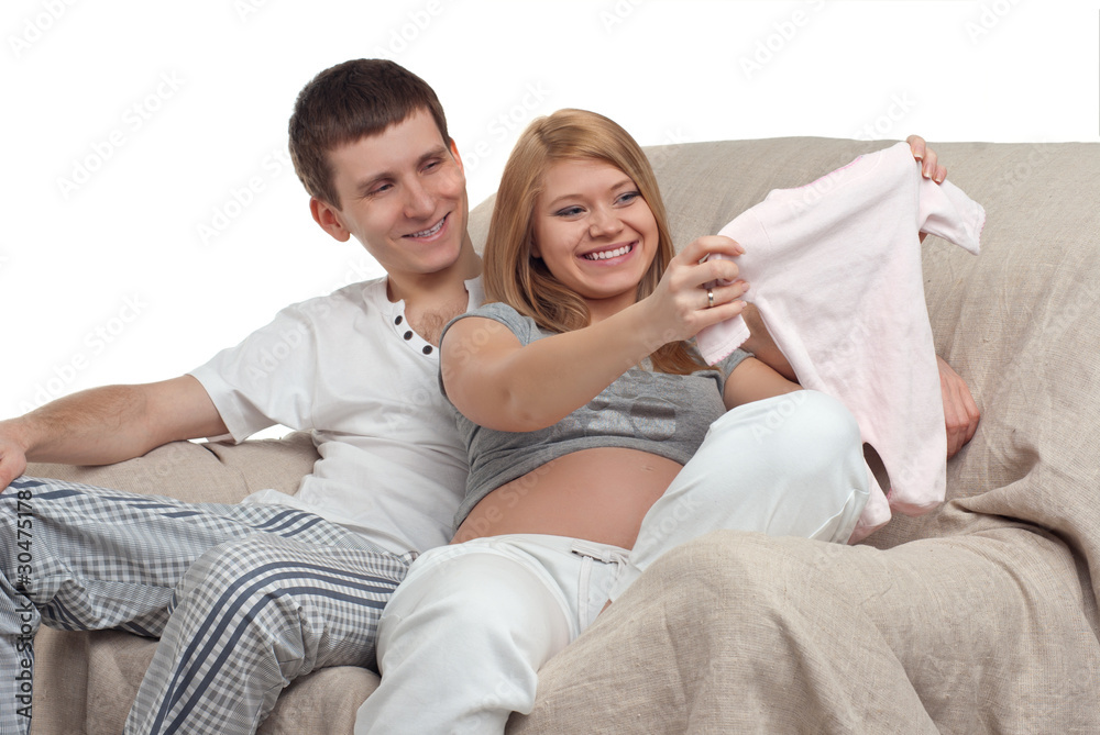 Couple choosing baby's clothes Couple choosing baby's clothes
