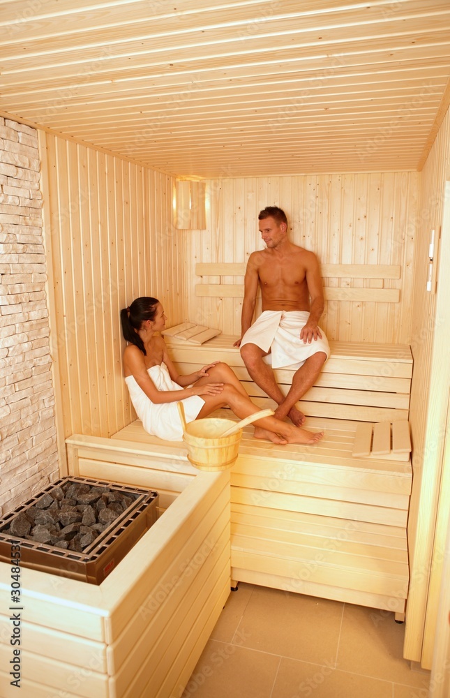 Couple talking in sauna Couple talking in sauna