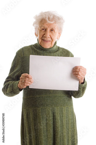 Obraz na płótnie Portrait of a happy senior woman holding blank billboard against