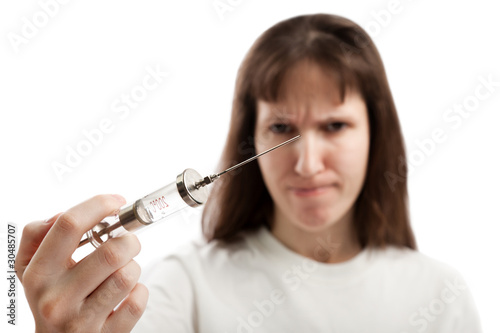 Women holding injecting syringe