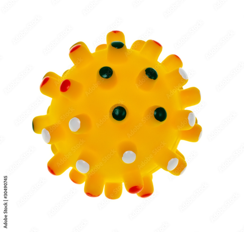 Yellow children's ball with spikes isolated on a white backgroun Yellow children's ball with spikes isolated on a white backgroun