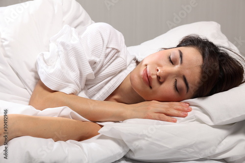 Beautiful woman sleeping in bed