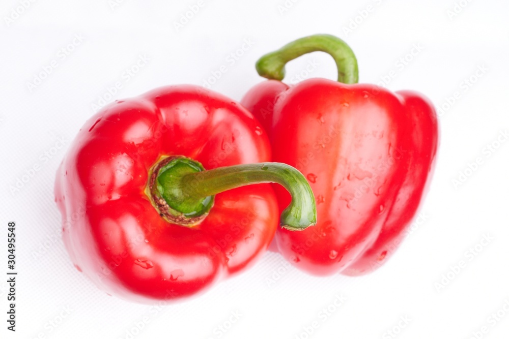 two red paprikas on white background two red paprikas on white background