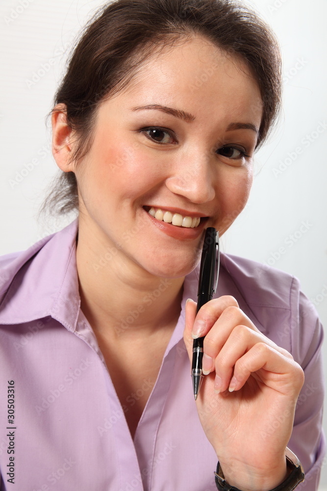 Beautiful Asian business woman holding pen Beautiful Asian business woman holding pen