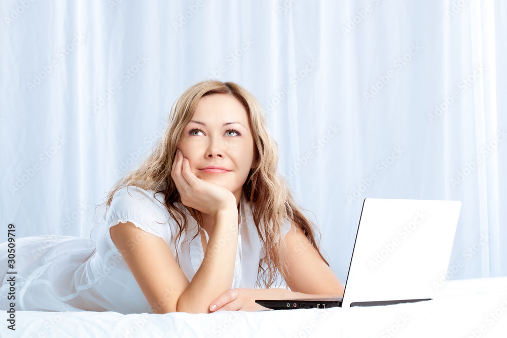 woman lying on bed with laptop woman lying on bed with laptop