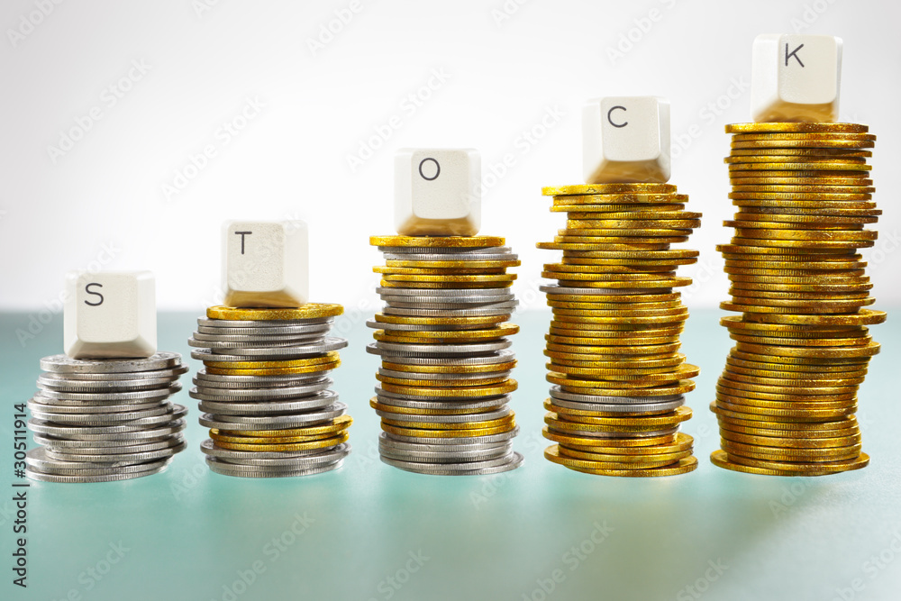 STOCK word on graph like coin stacks STOCK word on graph like coin stacks