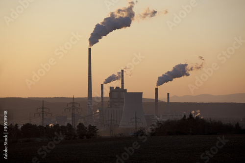 Power plant in sunset, smoking