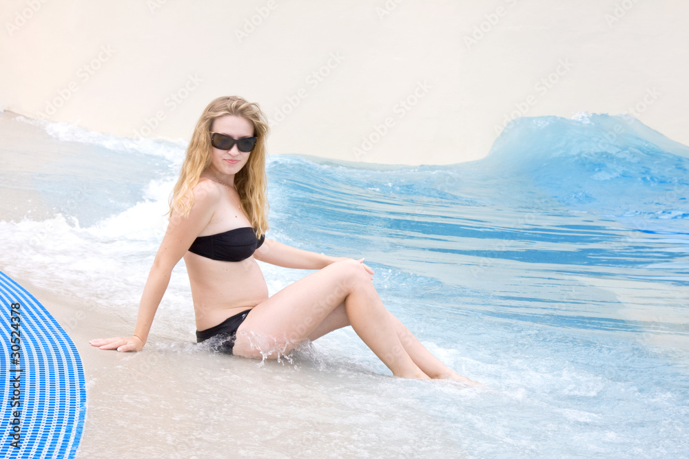 Young pregnant woman on a beach