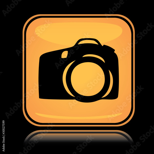 Yellow square icon photo camera with reflection over black