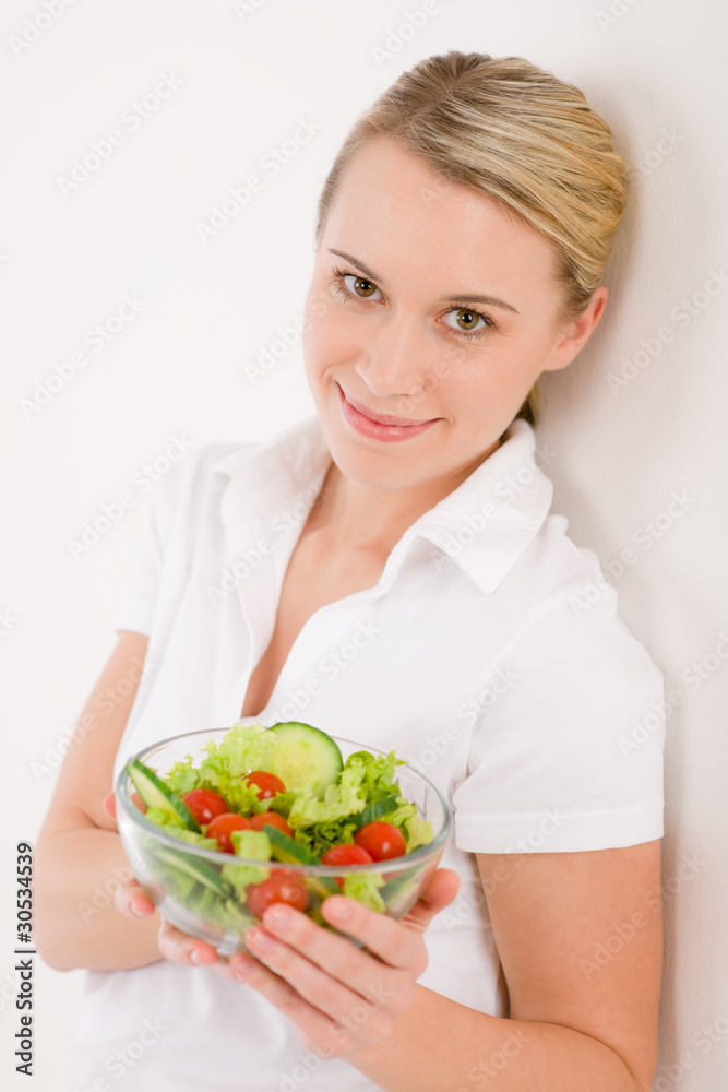Healthy lifestyle - smiling woman with vegetable salad Healthy lifestyle - smiling woman with vegetable salad