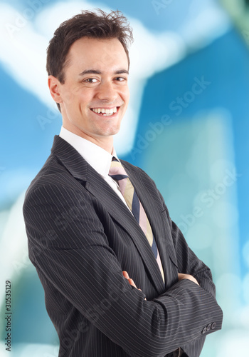 Young businessman smiling