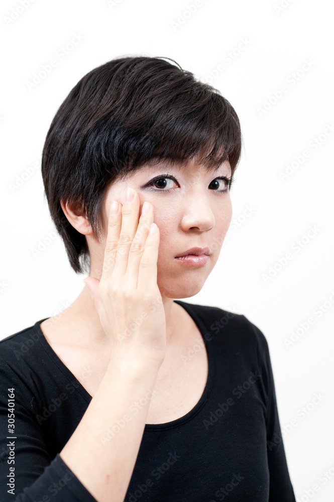 beautiful asian woman taking care of her eye beautiful asian woman taking care of her eye