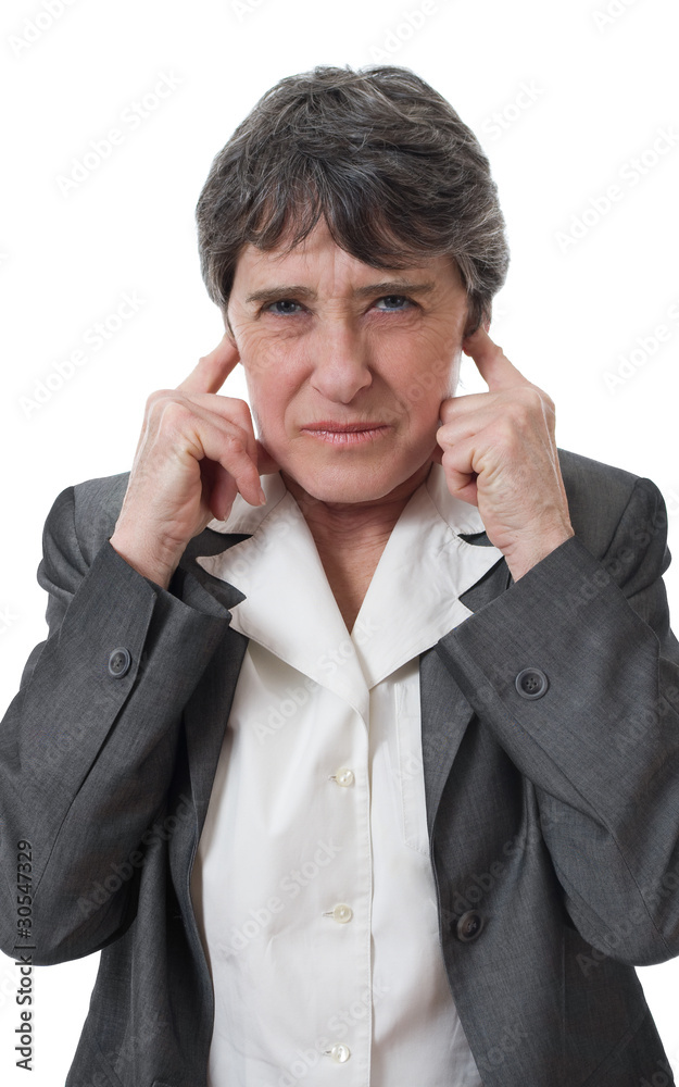 mature businesswoman closing ears with her fingers mature businesswoman closing ears with her fingers