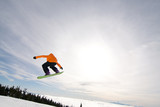 Male Snowboarder Catches Big Air.