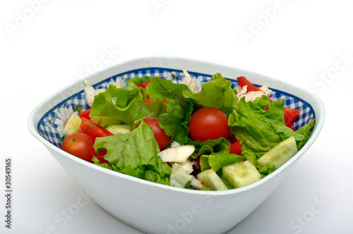 Vegetable salad from cucumbers, pepper, tomatoes, onions