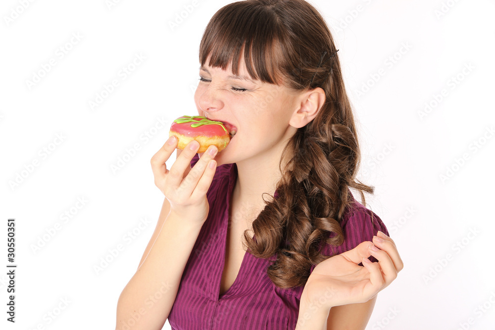 girl eating a donut and squinting pleasure girl eating a donut and squinting pleasure