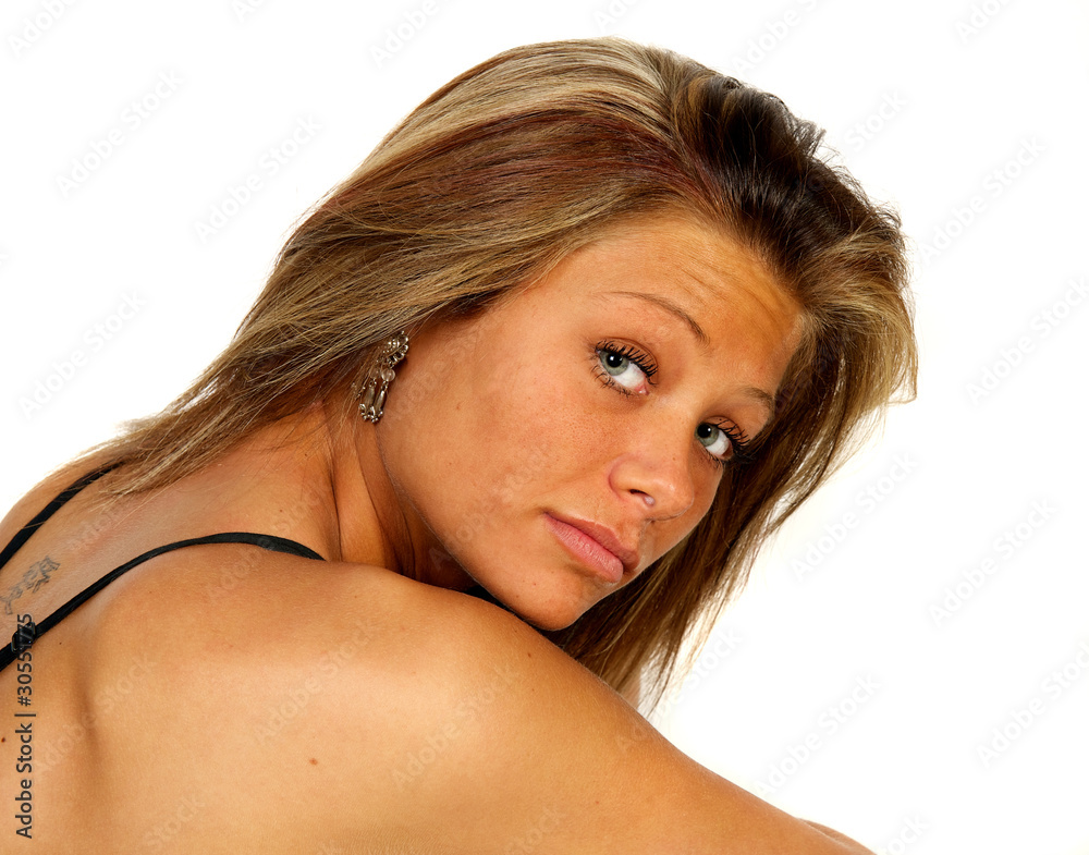 Blond female model in studio over white background. Blond female model in studio over white background.