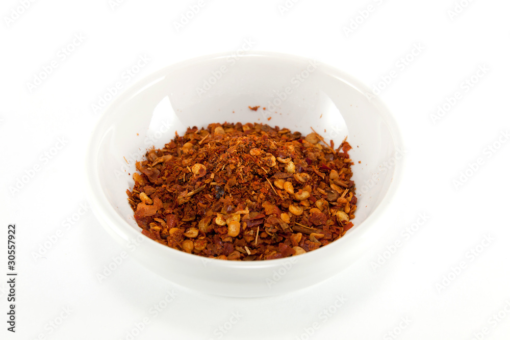 Ground red chili pepper isolated on white background Ground red chili pepper isolated on white background