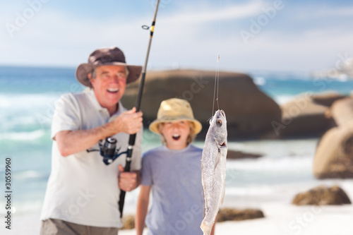 Man fishing with his grandson