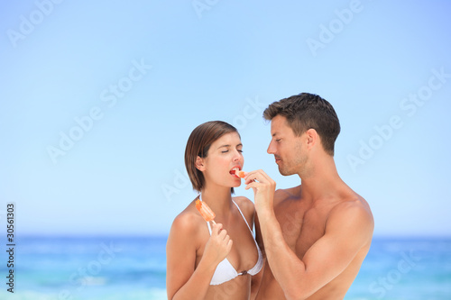 Lovers eating an ice cream