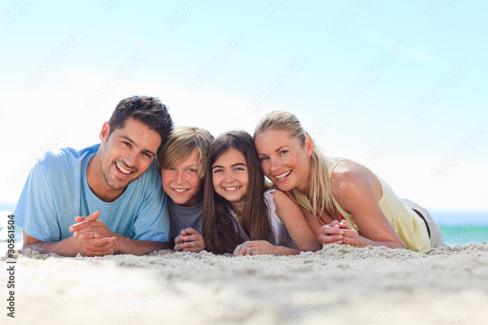 Children with their parents at the beach Children with their parents at the beach