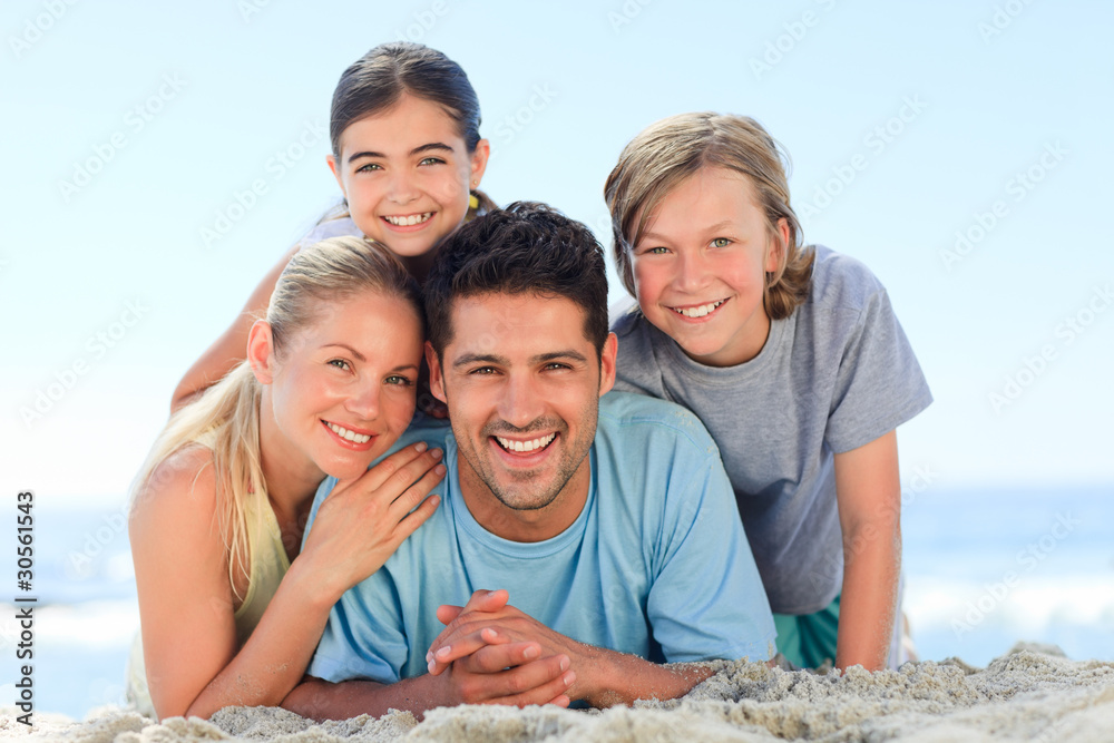 Portrait of a smiling famiy at the beach Portrait of a smiling famiy at the beach