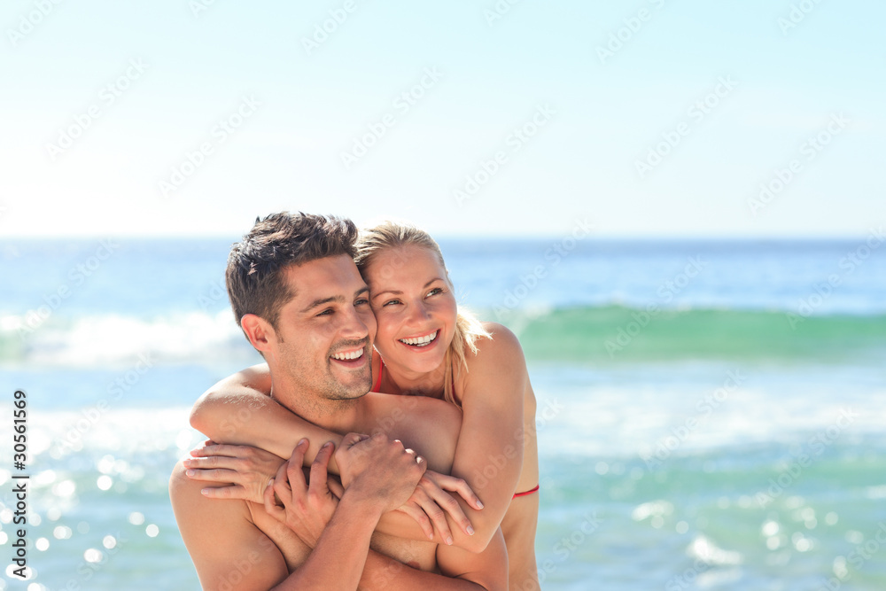 Happy lovers at the beach
