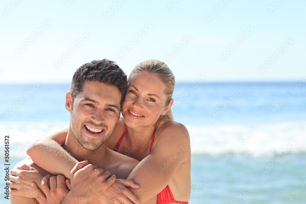 Happy lovers at the beach