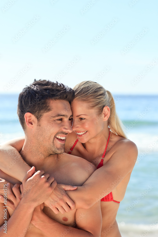 Happy lovers at the beach Happy lovers at the beach
