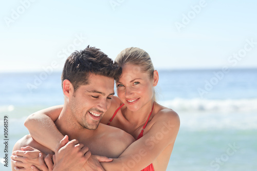 Happy lovers at the beach © WavebreakMediaMicro
