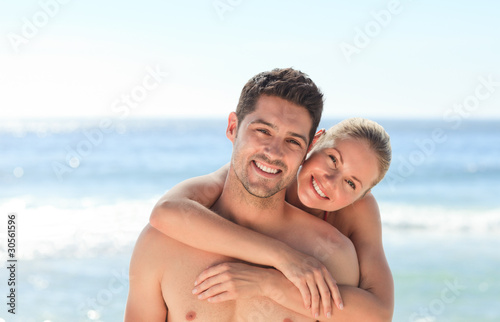 Joyful couple at the beach