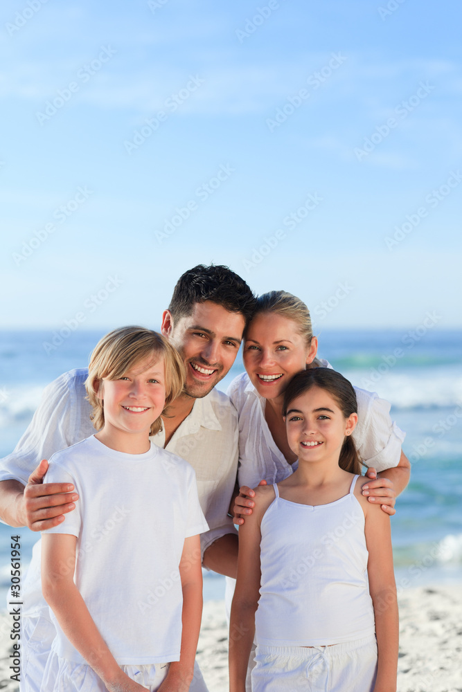 Portrait of a cute family at the beach Portrait of a cute family at the beach