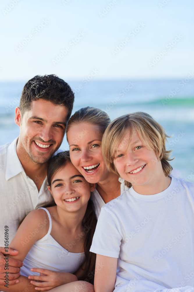Portrait of a cute family at the beach Portrait of a cute family at the beach