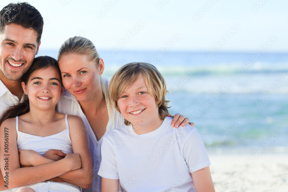 Portrait of a cute family at the beach Portrait of a cute family at the beach